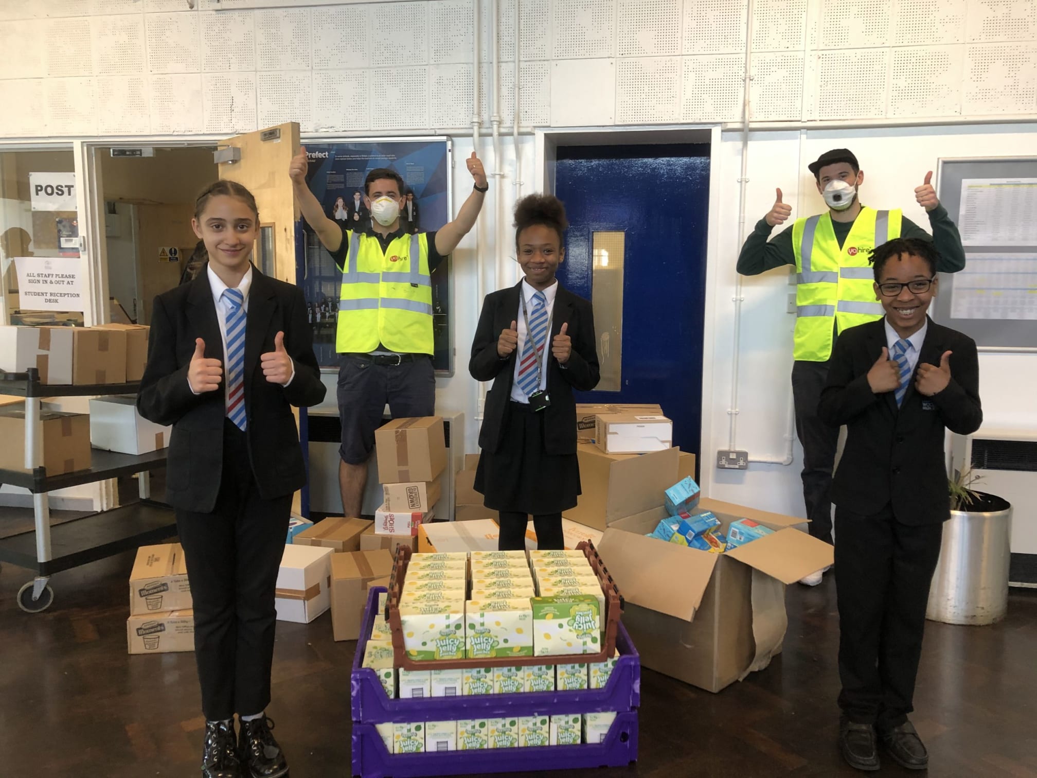 Students taking in a delivery of supplies